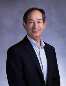 Headshot of Dr. Christopher Schneck, Executive Director, in a professional suit and tie