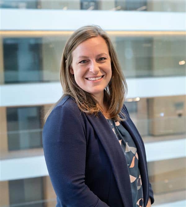 Dr. Aimee Sullivan, Child and Adolescent Psychologist, smiling in a professional navy top