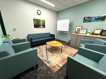 Cozy, modern office with teal chairs