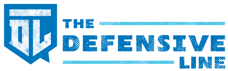 The Defensive Line logo featuring a blue block-style helmet icon and bold blue text